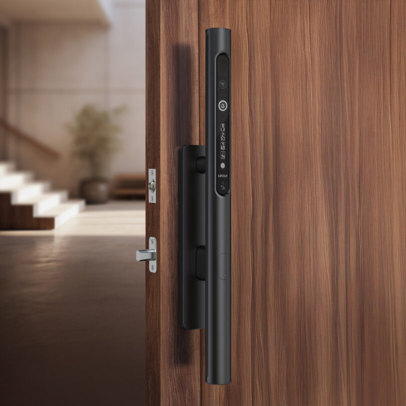 Smart door lock with digital keypad on a wooden door, interior staircase visible in the background.