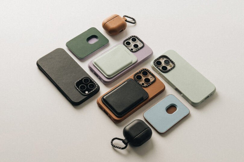 Various smartphone cases and wireless earbud cases in different colors and textures arranged on a neutral background.