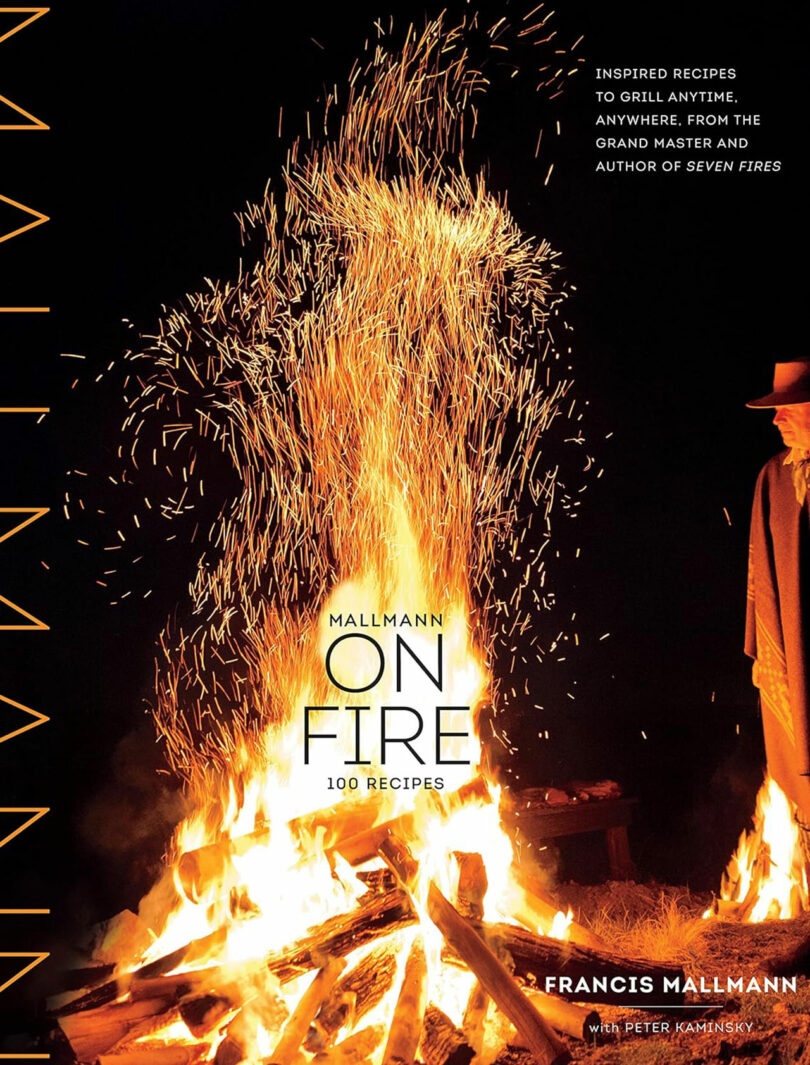 Book cover of "Mallmann on Fire" by Francis Mallmann, featuring a large, blazing fire at night with sparks flying upwards, and a figure standing near the flames.