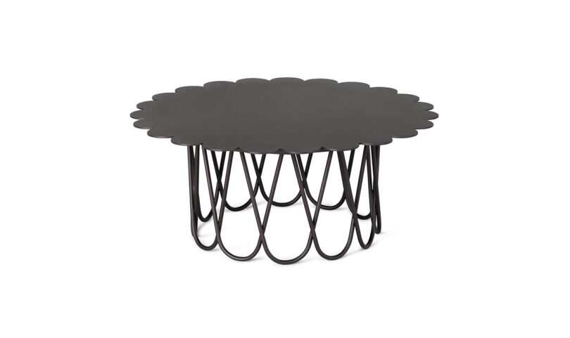 Black circular coffee table with a scalloped top and curved metal base supports on a white background.