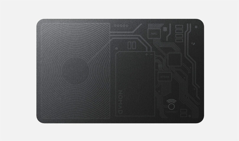 The Nomad black NFC-enabled smart card features an intricate circuit design on its sleek surface, perfect for the modern wanderer.