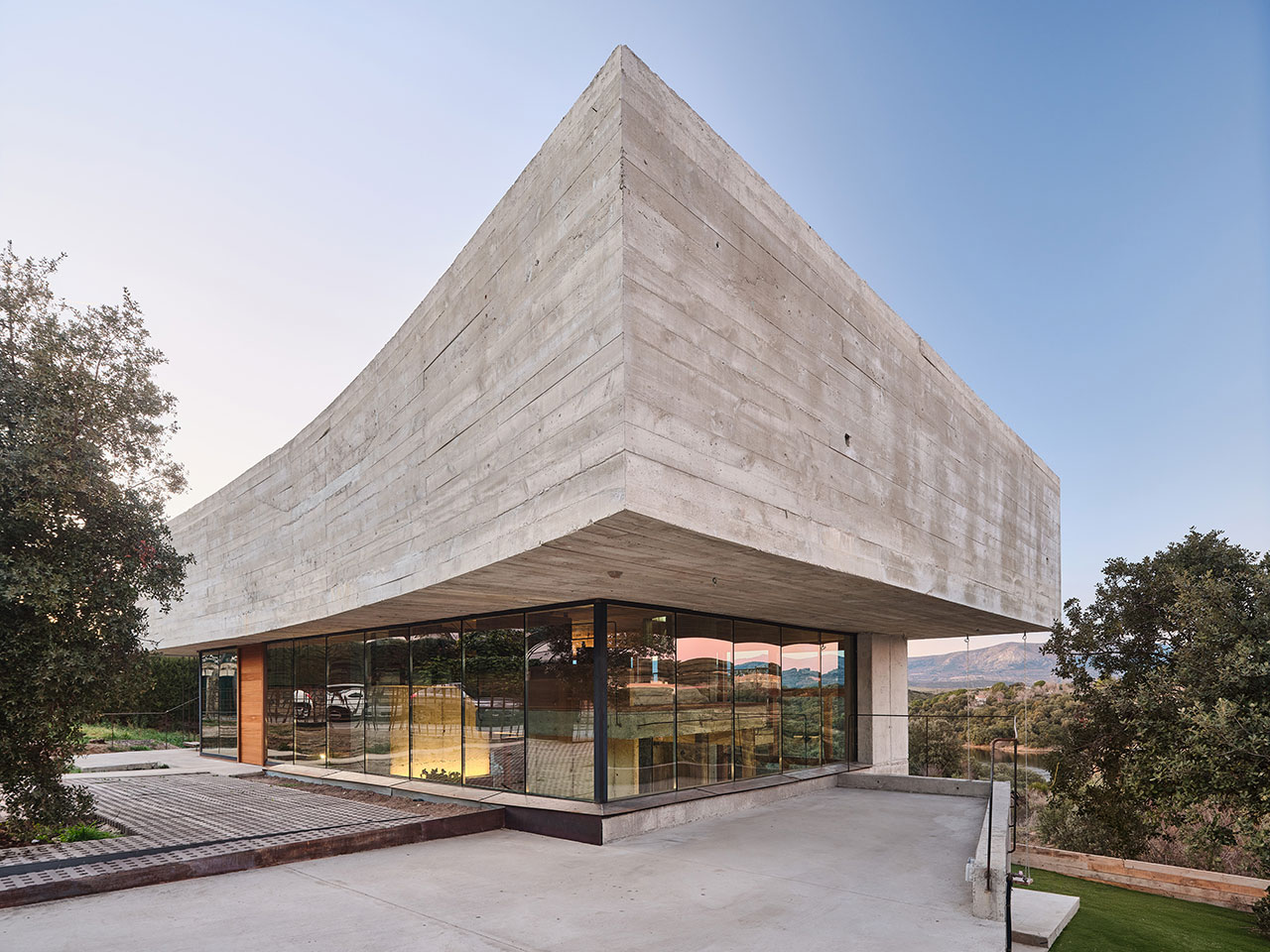 Oak House Is a Concrete and Glass Home With Floating Levels