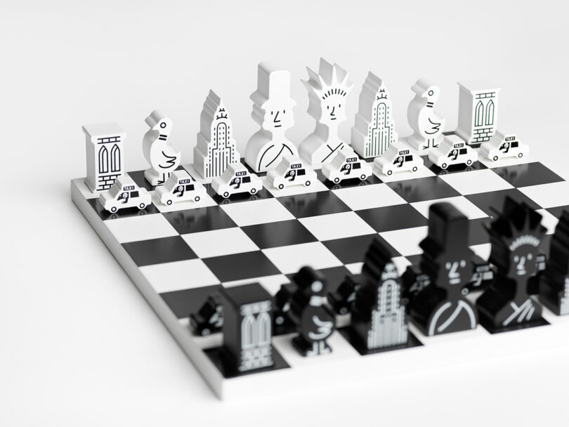 Black and white chess set with modern, stylized pieces inspired by urban motifs on a checkered board.