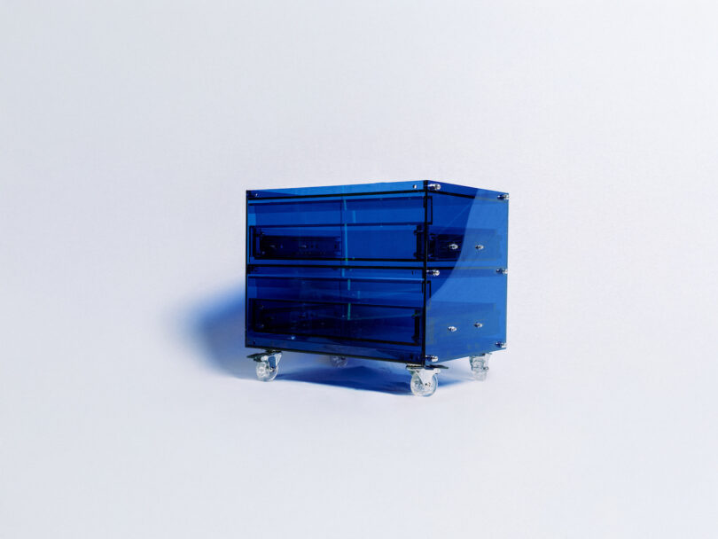 Blue transparent two-drawer storage unit on wheels, placed against a plain white background