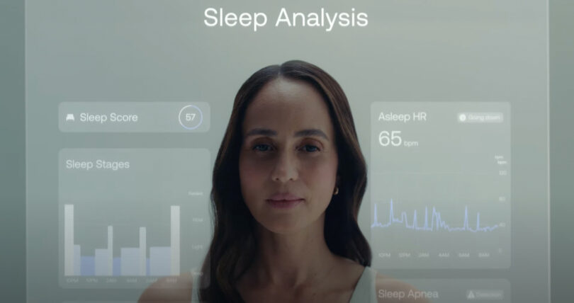 Woman standing in front of a transparent display showing sleep analysis data, including sleep score, stages, and heart rate.