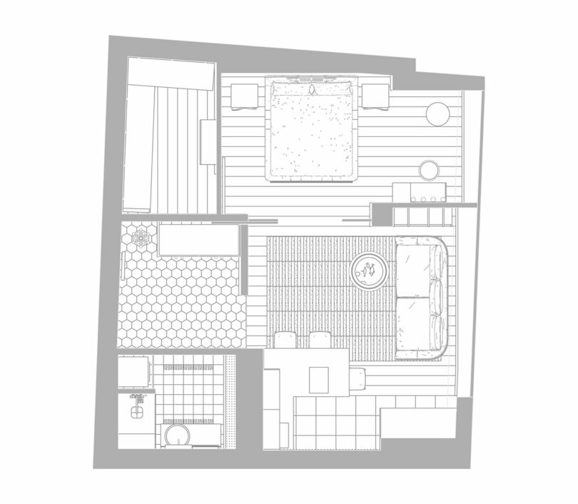 Black and white architectural floor plan of an apartment with a bedroom, living area, kitchen, and bathroom.