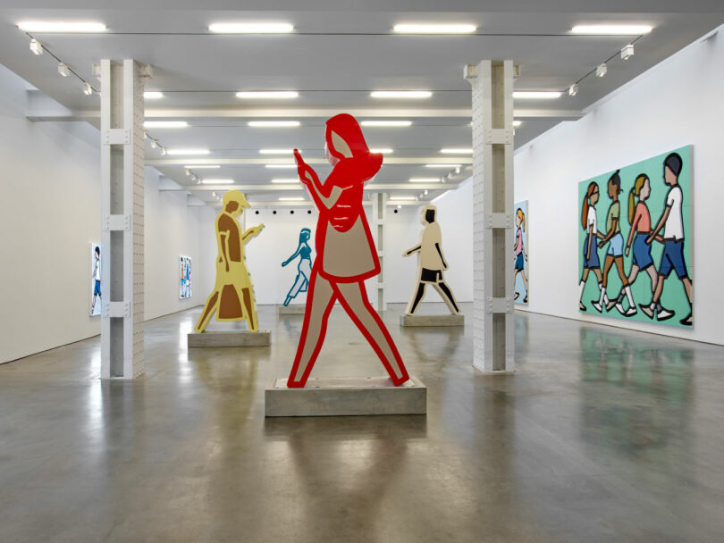 Gallery exhibition with Red walking figure