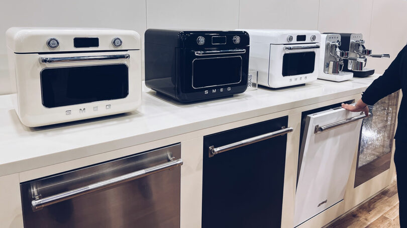 Showcasing SMEG kitchen appliances, including ovens, espresso machines, and dishwashers, this display was a standout at KBIS.