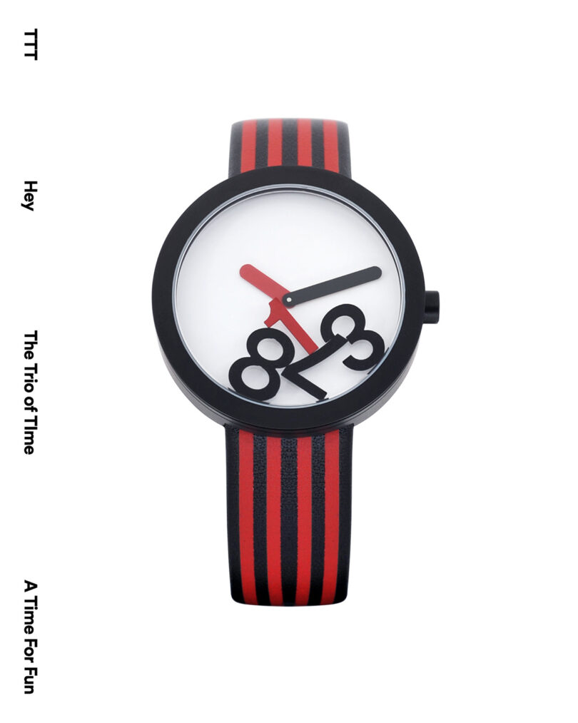 A watch with a black frame and red-black striped strap features numbers 8, 9, and 3 arranged abstractly against a white face. Red hour and black minute hands are shown. White background.