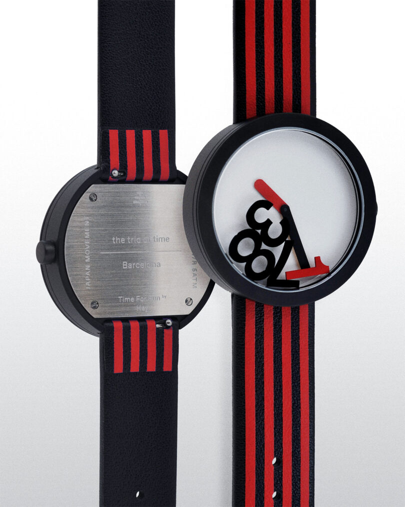 Front and back view of a wristwatch with a modern design. It has a red, black, and white face with abstract numbers, and a black strap with red stripes.