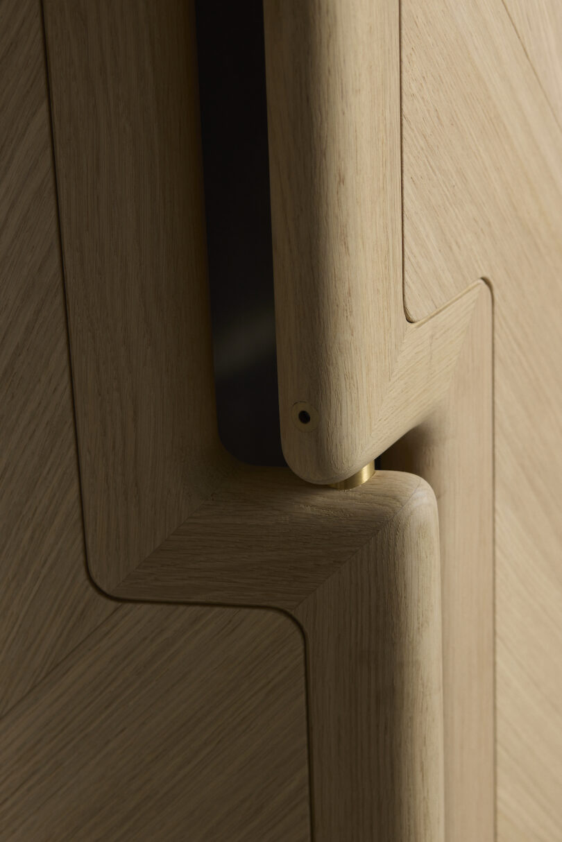 Close-up of interlocking wooden panels with smooth edges, showcasing meticulous craftsmanship and natural wood grain pattern