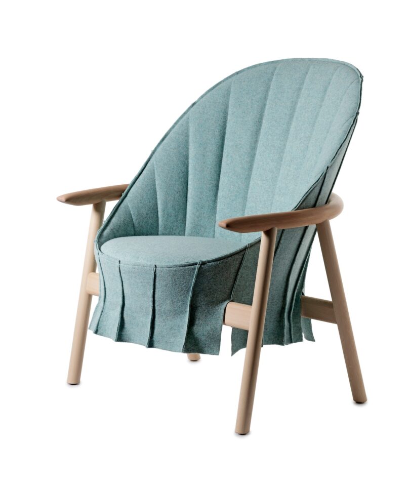 A light blue lounge chair with a tall, curved back and wooden armrests and legs, featuring a pleated fabric design.