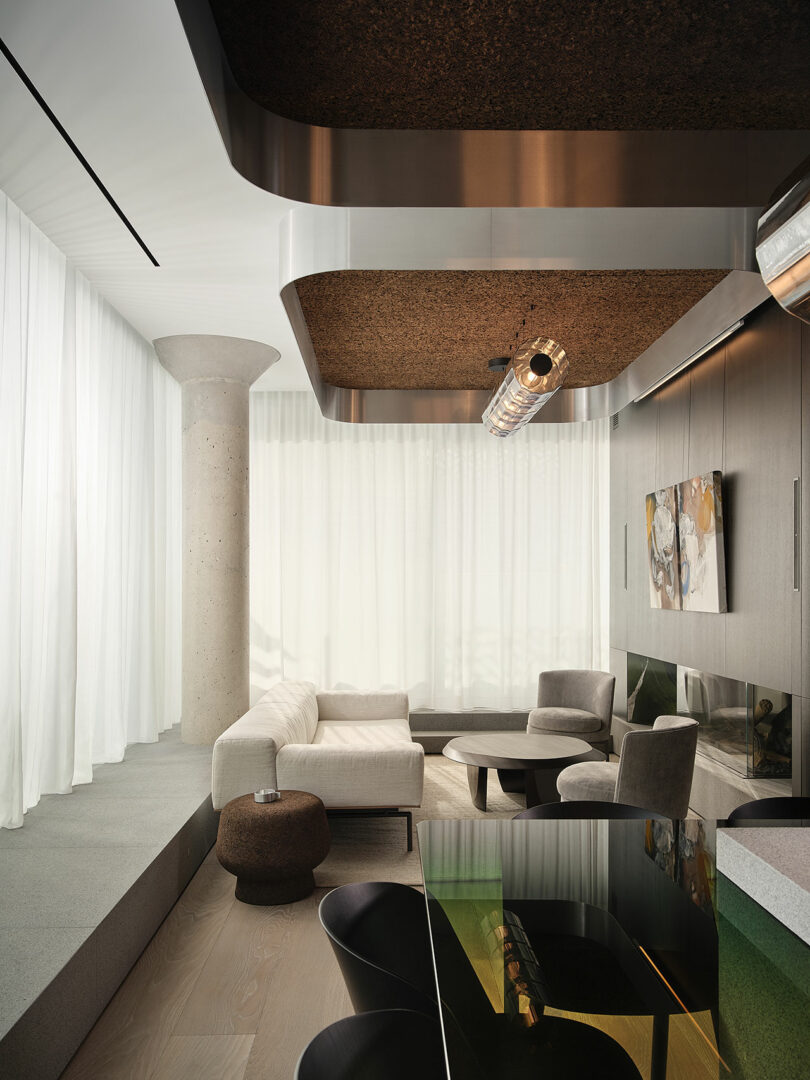 Modern living room with floor-to-ceiling sheer curtains, concrete pillar, sectional sofa, armchairs, wall-mounted fireplace, contemporary lighting, and sleek black dining table and chairs.