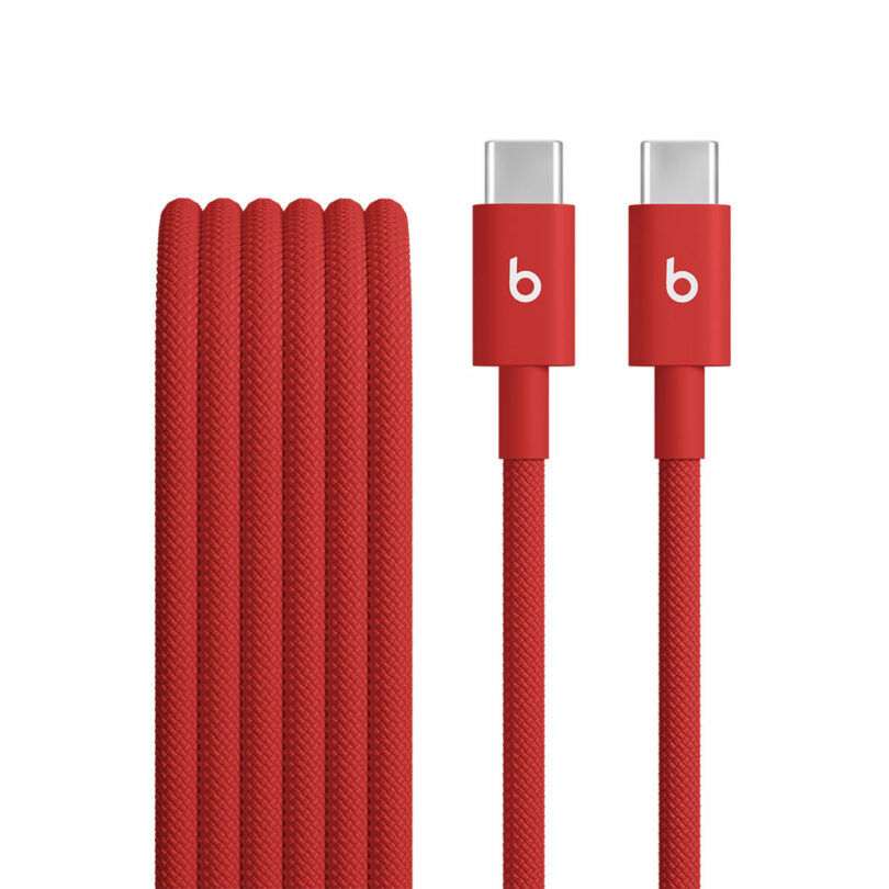 A red braided USB-C to USB-C charging cable with the iconic Beats logo on both connectors, shown coiled with both Beats-branded ends visible.