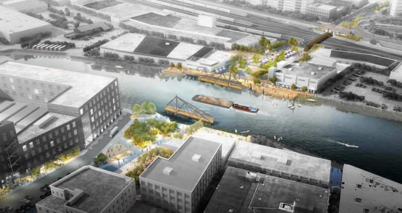 Aerial view of an urban development on the water of Jun Aizaki, with pedestrian bridges, green spaces, river boats and industrial buildings around the area.
