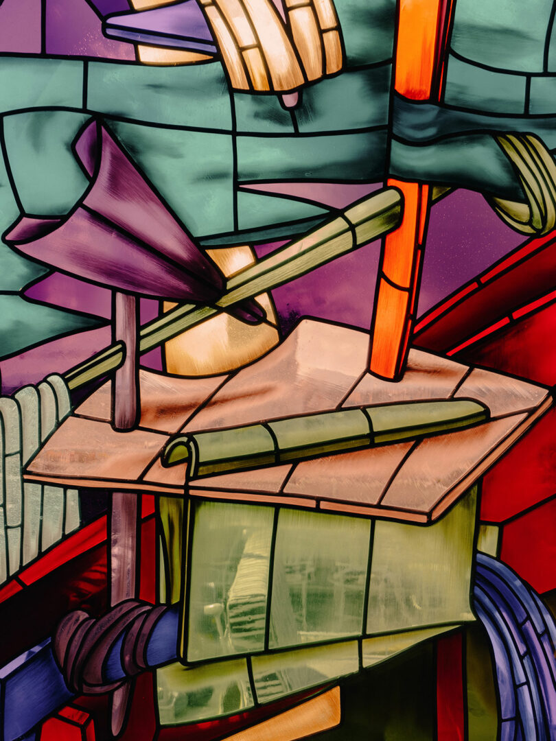 Abstract stained glass artwork featuring overlapping geometric shapes in green, purple, orange, and red, with bold black outlines and varying textures throughout.