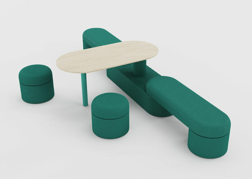 A modern seating arrangement with two green upholstered benches, two matching round stools, and a light wooden oval table.