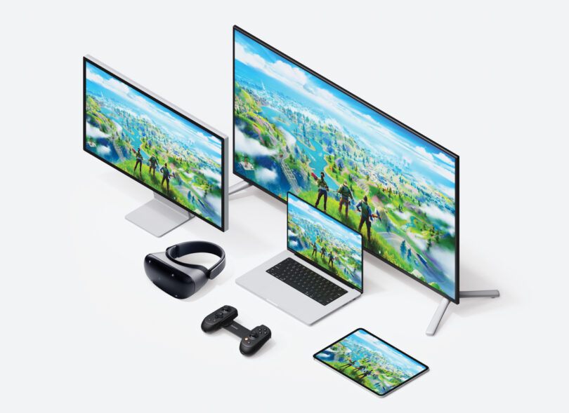 Variety of electronic devices including monitors, a laptop, a tablet, a VR headset, and controllers, all displaying the same colorful game scene.