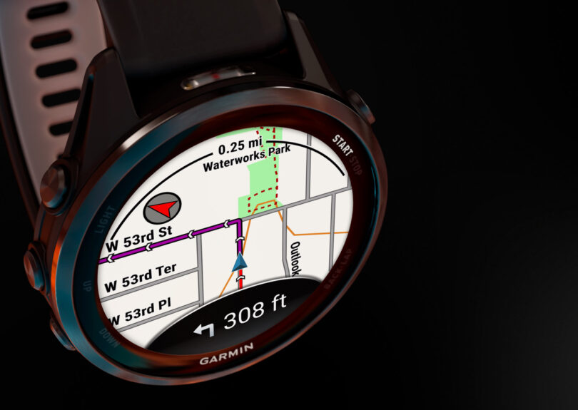 A Garmin smartwatch displays a navigation map with directions, showing the route to Waterworks Park and the remaining distance of 308 feet on its Garmin interface.