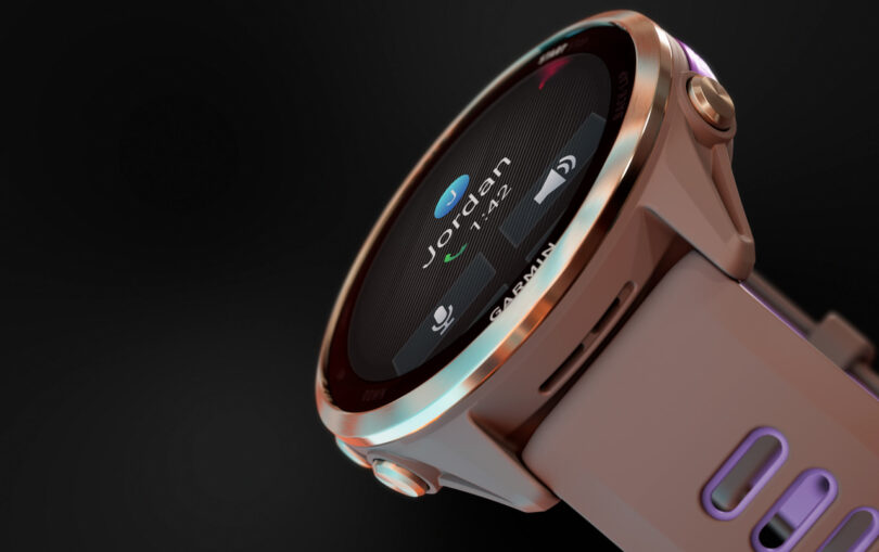 Close-up of a rose gold Garmin smartwatch displaying an incoming call from "Jordan" on its screen, with the Garmin brand name clearly visible on the bezel.