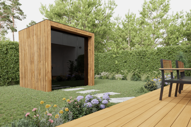 A modern wooden garden shed stands on a lawn with stone steps, surrounded by flowers and greenery, next to an outdoor patio