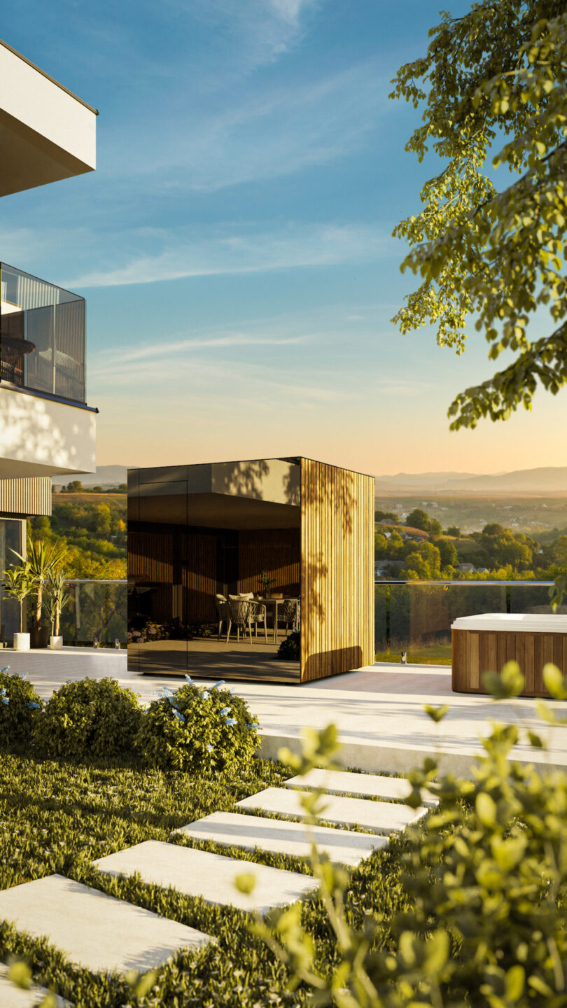 Modern outdoor scene with a small wooden and glass pavilion, patio furniture inside, and a view of rolling hills under a clear sky