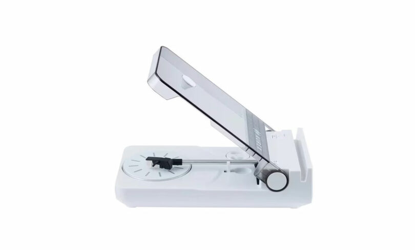 The AX-RP10 white mandoline slicer, featuring an adjustable blade and a food holder, is shown on a plain white background.