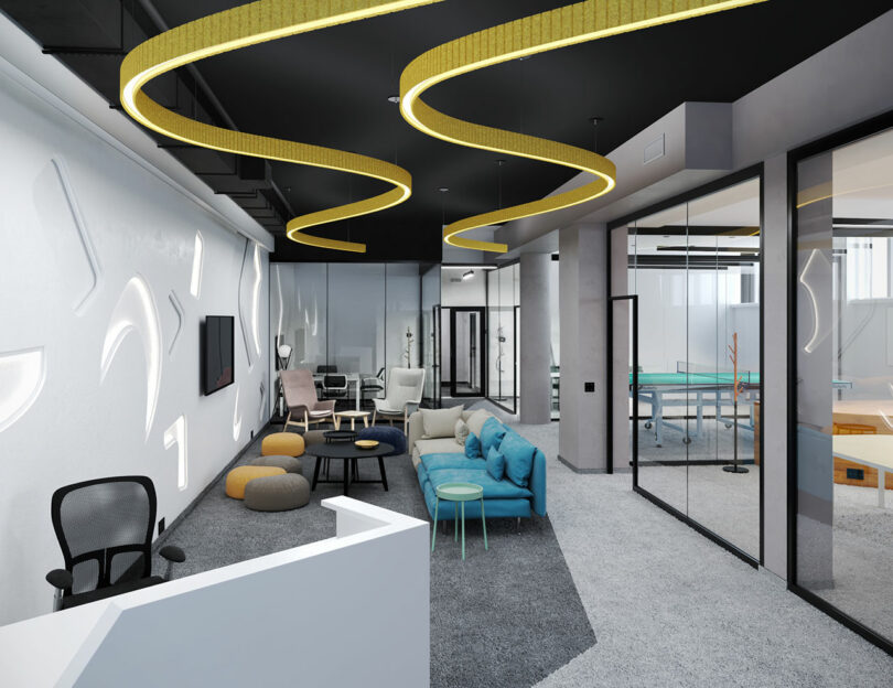 Modern office lounge with colorful seating, a reception desk, unique ceiling lights, and glass-walled meeting rooms in the background.