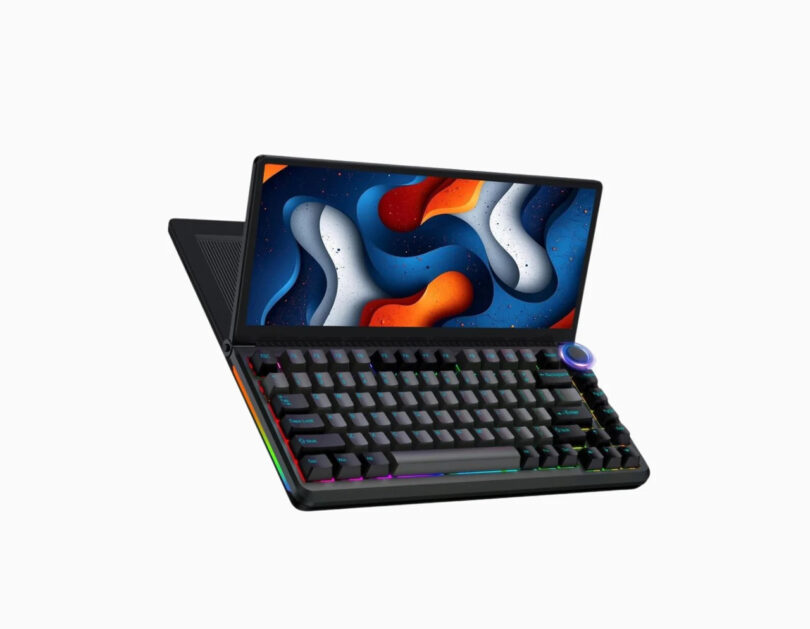 A compact laptop with a colorful abstract image on its screen and a built-in mechanical keyboard featuring RGB lighting and a control knob on the top right corner.