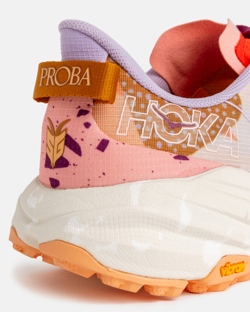 Close-up of the heel of a HOKA running shoe with a colorful design, "PROBA" label, and visible Vibram sole branding