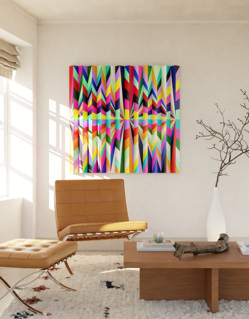 A modern living room with a tan leather chair, low wooden table, abstract colorful geometric artwork on the wall, and a decorative branch in a vase