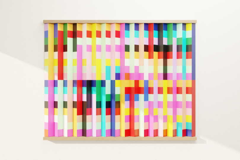 A rectangular wall art piece with vertical wooden slats, each painted with bright, multicolored pixel-like blocks in a geometric pattern