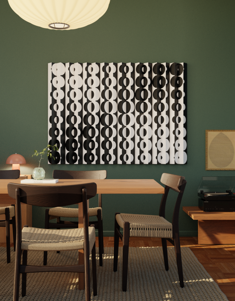 Dining room with a wooden table, four chairs, a green wall, geometric black and white art, a pendant light, lamps, and a turntable on a side table