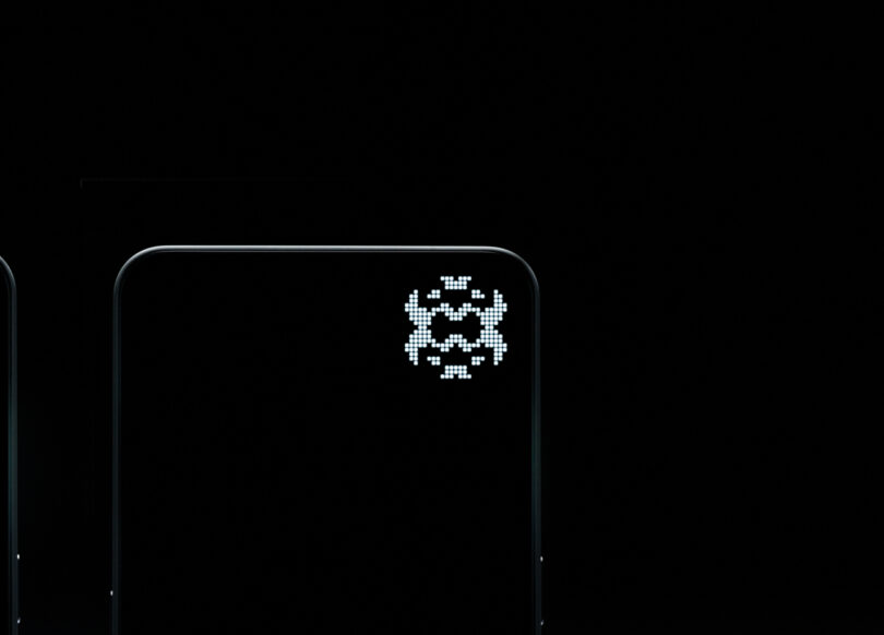 A minimalist image shows a pixelated alien figure on a dark Nothing screen, resembling the design from classic arcade video games.