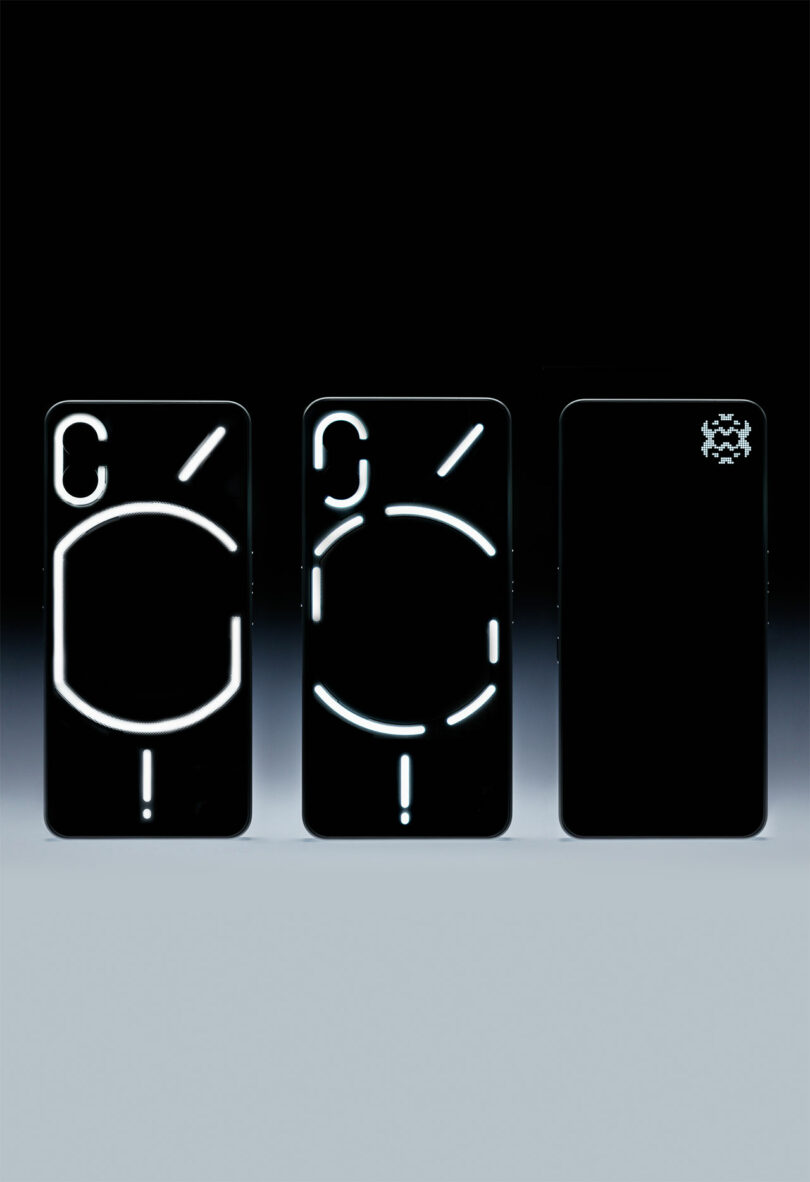 Three smartphones are displayed upright; two Nothing phones feature illuminated geometric patterns on their backs, while the third has a small lighted symbol in the top right corner.