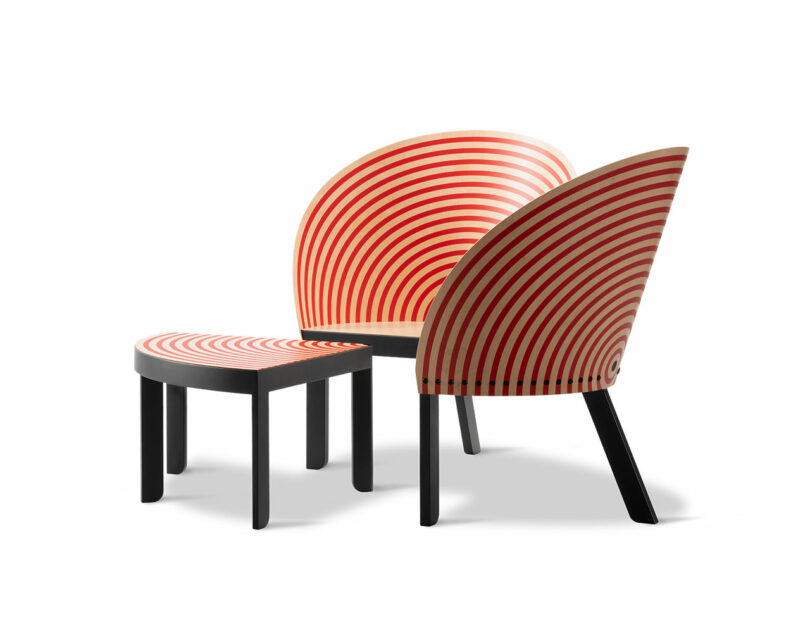 Two modern chairs with curved backs and a matching stool, all featuring concentric red and white circular patterns and black legs, evoke the playful style of a Bench for Two, set against a crisp white background.
