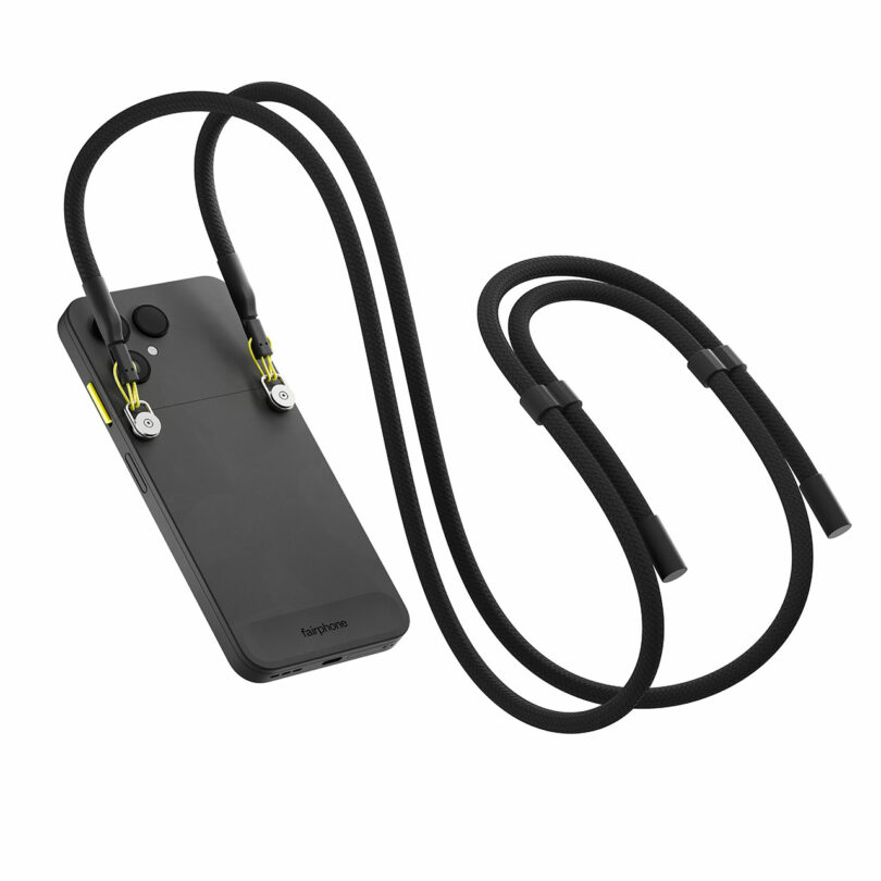 A black Fairphone with a modular case, attached to a long, adjustable black lanyard featuring yellow accents.
