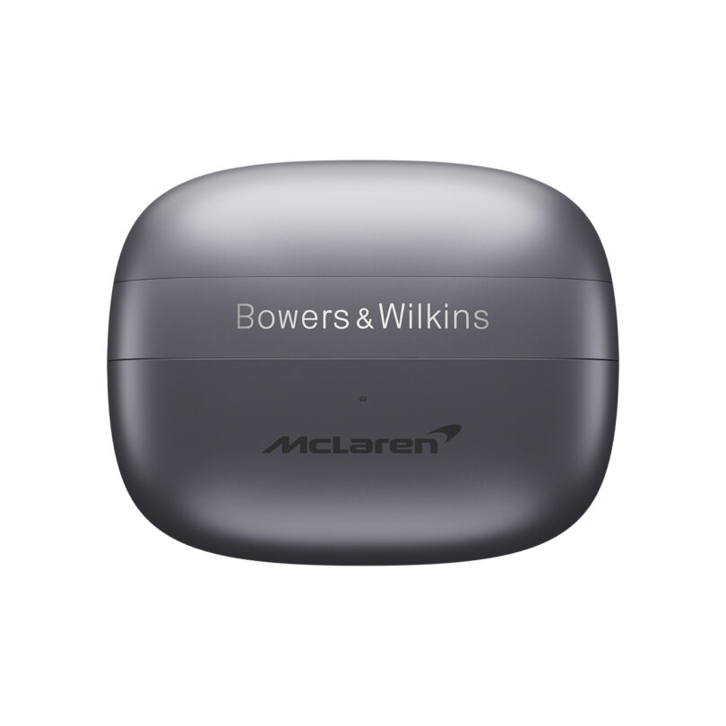 A matte gray wireless earbud charging case with "Bowers & Wilkins" and "McLaren" logos printed on the lid.