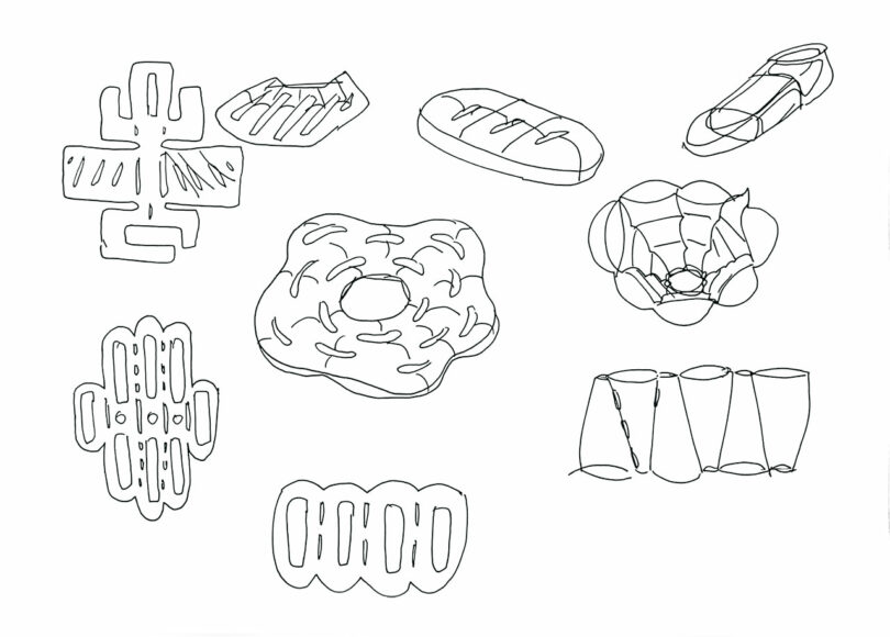 A black and white line drawing shows various types of pastries and bread, including loaves, a donut, and other distinct baked goods, arranged on a plain background.