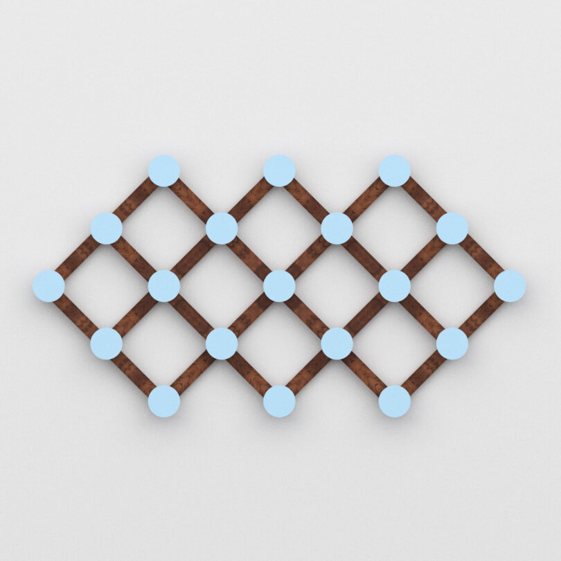 A geometric wooden lattice wall hook with intersecting brown slats and blue circular nodes at each intersection, displayed against a plain white background.