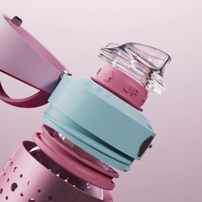 A close-up of a pastel-colored water bottle with a transparent cap and pink and blue components, set against a light pink background