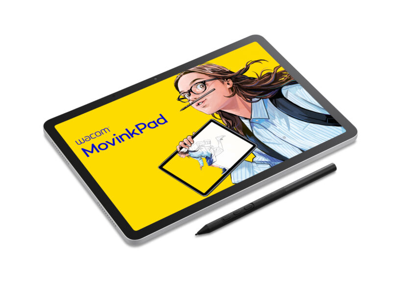 A digital drawing tablet displaying an illustrated woman holding a tablet, with the text "wacom: MovinkPad" on a yellow background; a stylus lies beside the tablet.