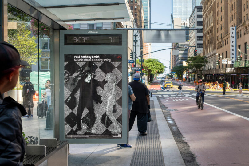 artwork at bus stop with commuters