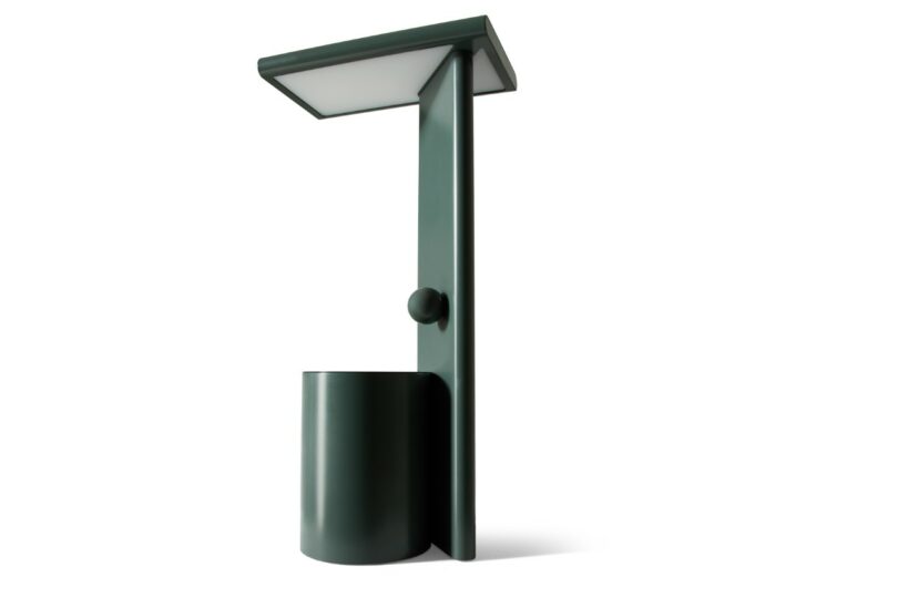 A modern dark green table lamp with a rectangular flat top and cylindrical base against a plain white background