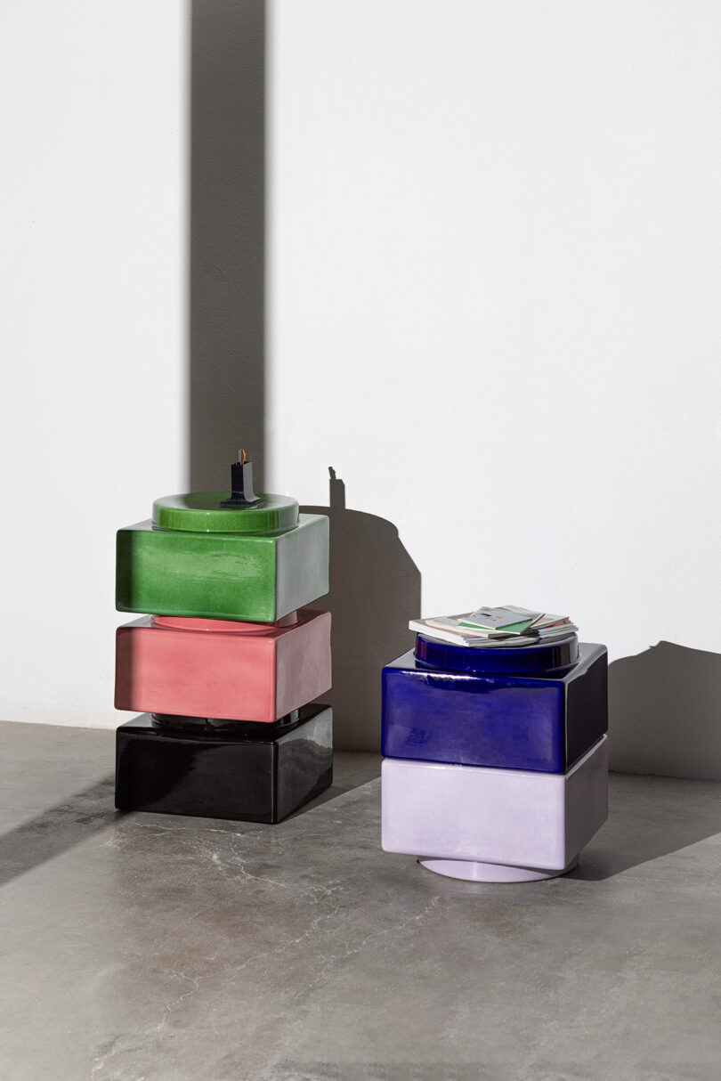 A group of colorful objects on a concrete surface.