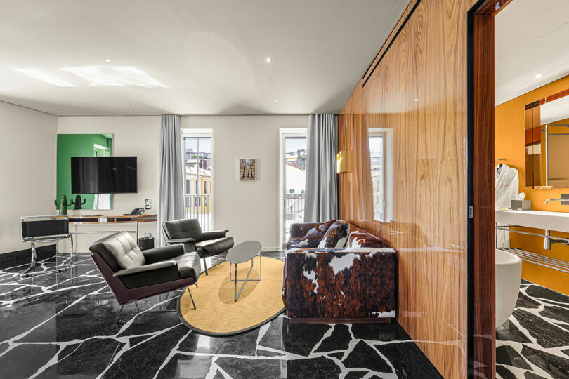 A room with a couch and a table.