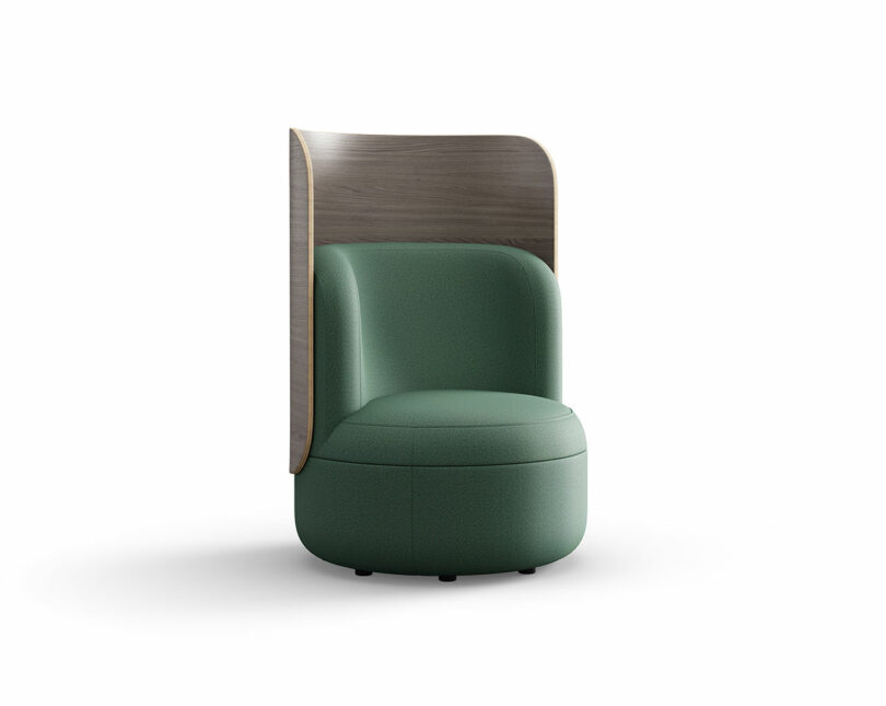 A modern green upholstered chair with a rounded seat and backrest, featuring a tall, curved wooden panel attached to the back.