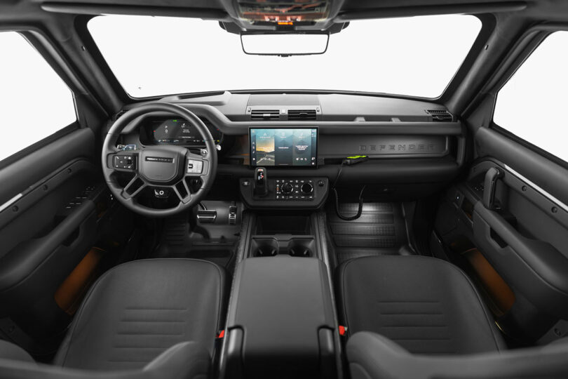 Interior view of a modern SUV showing a digital dashboard, touchscreen display, steering wheel, and two black front seats.