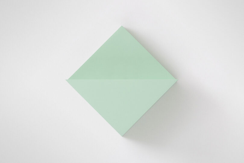 A green light sits on a plain white background.