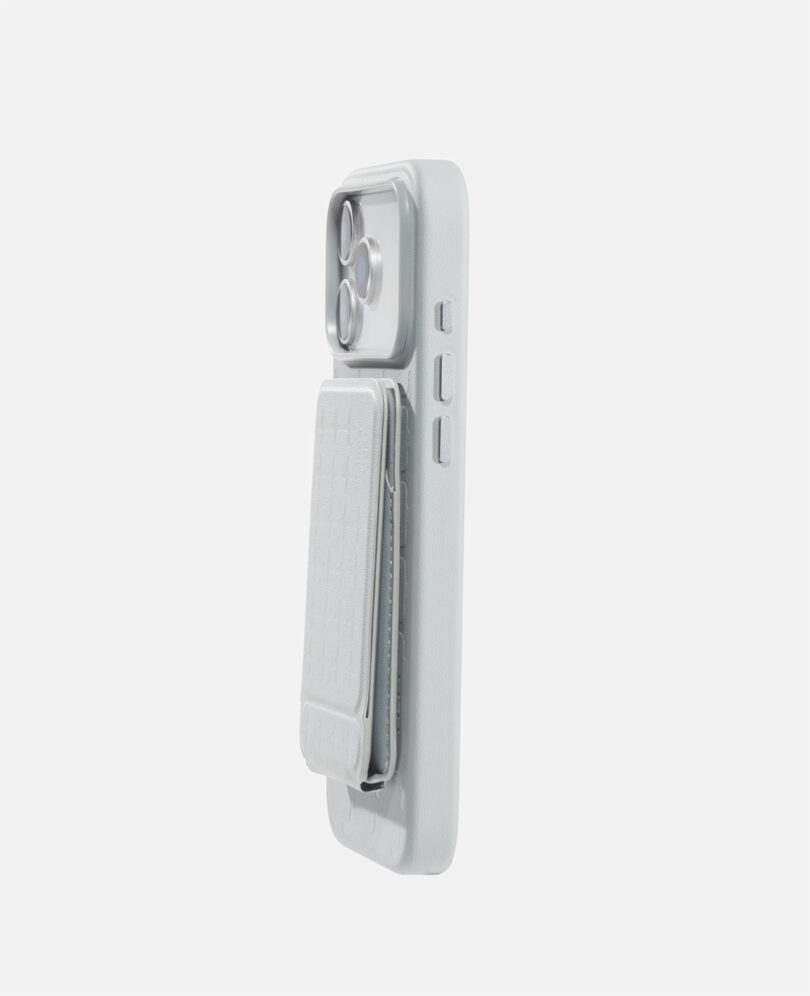 A white smartphone case with attached cardholder and visible camera lenses, shown standing upright on a plain white background.